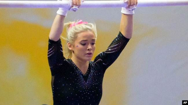 FILE - Livvy Dunne, seen here on Feb. 5, 2022, is a gymnast at LSU. She has millions of social media followers and is making money through name, image, likeness, or NIL deals. (AP Photo/Matthew Hinton, File)