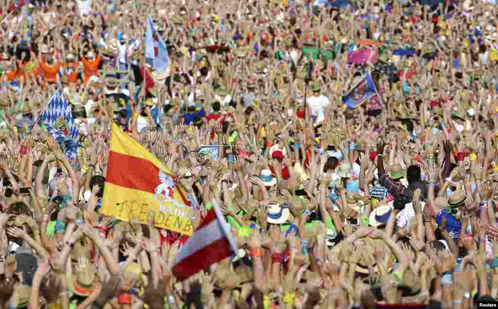 The faithful celebrate before a meeting with Pope Francis in St Peter's square at the Vatican.