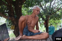 Tith Morn, 73, a former Khmer Rouge soldier, sits in front of his home in Anlong Veng district. “We protected the nation and the territory,” he said in April. (Aun Chhengpor/VOA Khmer)