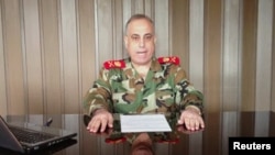 General Abdelaziz Jassim al-Shalal, the head of Syria's military police, speaks in a video uploaded on a social media website, December 26, 2012.