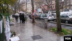 People walk near the Bataclan theater at 50 Boulevard Voltaire in the 11th arrondissement of Paris, where terrorists killed dozens of people on Nov. 13, 2015. (Photo taken by L. Bryant)