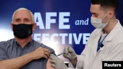 U.S. Vice President Mike Pence receives the COVID-19 vaccine at the White House in Washington, U.S., December 18, 2020. REUTERS/Cheriss May TPX IMAGES OF THE DAY