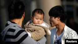 Over the years, China has relaxed its family planning laws. The country now allows millions of families to have two children. But letting single women have children or even freeze their own eggs is a different story. (Reuters file photo 2013)