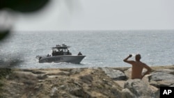 Security forces patrol near the shore in the port city of La Guaira, Venezuela, May 3, 2020. Interior Minister Nestor Reverol said the security forces overcame before dawn an armed maritime incursion with speedboats from neighboring Colombia