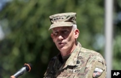 FILE - Commander of the Resolute Support mission and U.S. Forces in Afghanistan Army Gen. John W. Nicholson speaks during an opening ceremony of "Invictus Games" at the Resolute Support Headquarters, in Kabul, Afghanistan, May 13 , 2017.