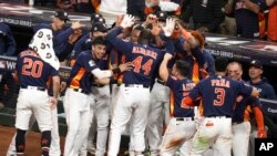 FILE - Houston Astros' Yordan Alvarez celebrates after his three-run home run during the sixth inning in Game 6 of baseball's World Series against the Philadelphia Phillies, Nov. 5, 2022.