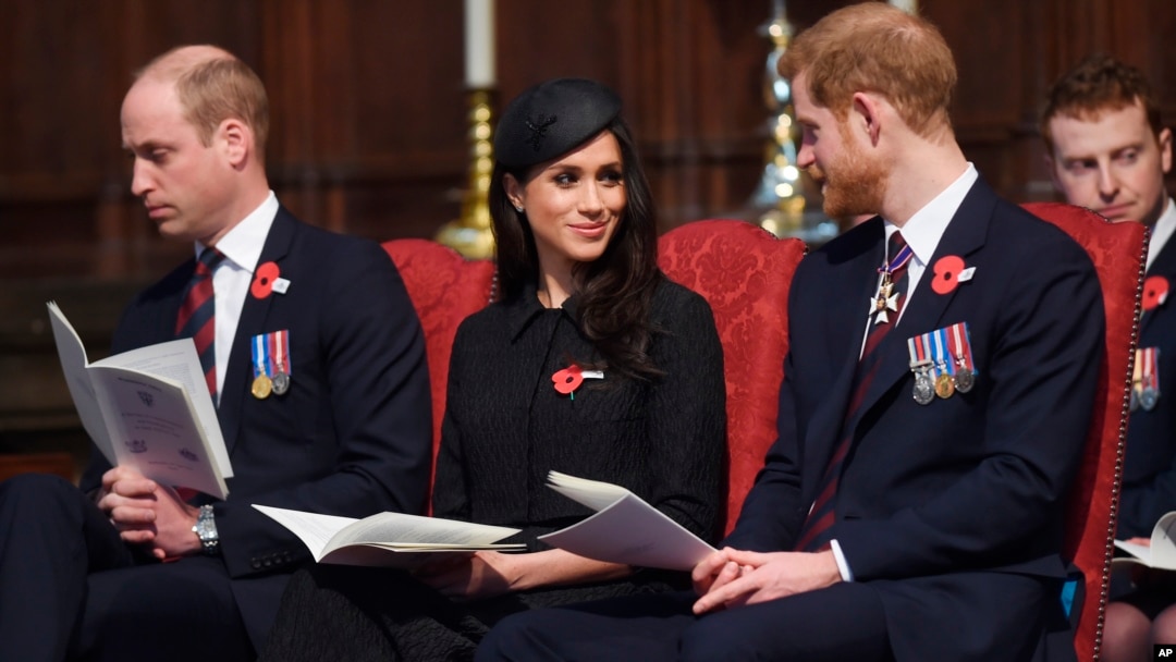 Britain's Prince William, left, Prince Harry and Meghan Markle attend a Service of Thanksgiving and Commemoration on ANZAC Day at Westminster Abbey in London, April 25, 2018. 