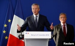 FILE - French Finance Minister Bruno Le Maire speaks during a news conference about the situation with Renault, at the Bercy Finance Ministry in Paris, Nov. 21, 2018.