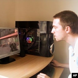 Andrew Bostock plays America's Army at his home in Staffordshire, England, 12 Jul 2010