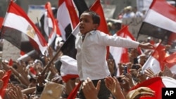 A young Egyptian protester shouts slogans at Tahrir Square in Cairo, April 1, 2011