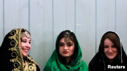 FILE - Young Afghan women attend teachers' graduation ceremony, Kabul, March 30, 2011.