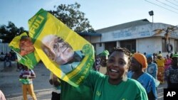 Supporter of the ruling CCM party in Tanzania celebrate after the party’s presidential candidate, John Pombe Magufuli was declared a winner, in Dar es Salaam, Tanzania, Oct. 29, 2015.