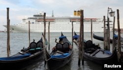 FILE - The Costa Classica cruise ship is seen in the Venice lagoon, May 18, 2012.