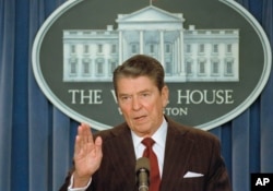 In this Nov. 25, 1986 file photo, then President Ronald Reagan tells reporters "I'm not taking any more questions" as questions about the Iran-Contra scandal mounted.