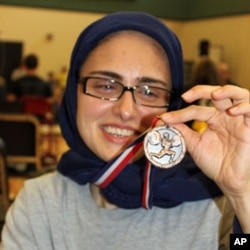 Kulsoom Abdullah sporting a medal she earned at a 2010 Open Championship in the US state of Georgia