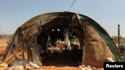 A damaged tent for displaced people is pictured after airstrikes on the outskirts of the rebel-held town of Atareb in Aleppo province, Syria, Aug. 4, 2016.