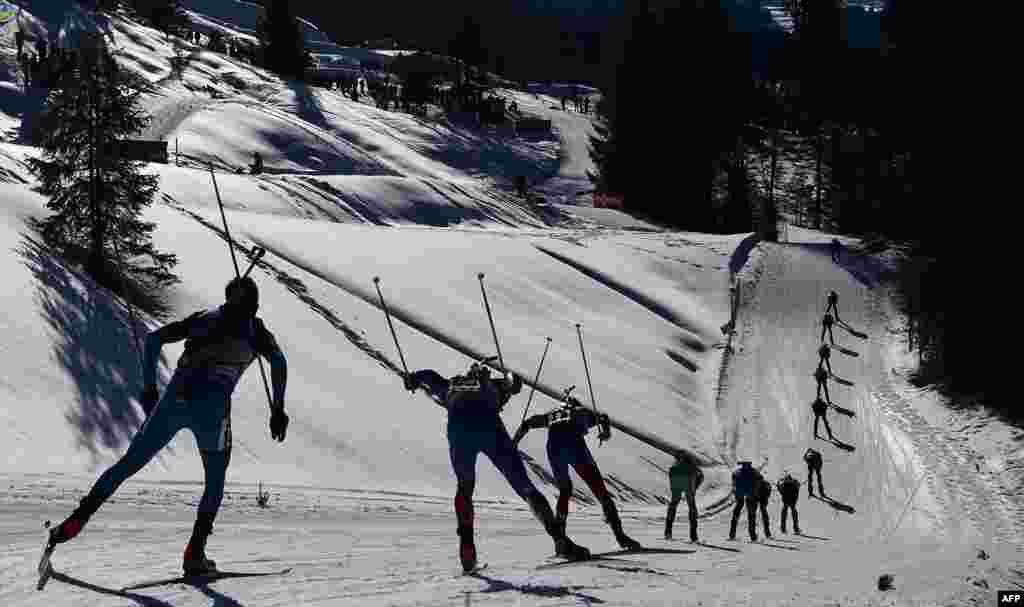 Biathletes compete during the men&#39;s 15 km mass start race at the Biathlon World Championships in Hochfilzen, Austria.