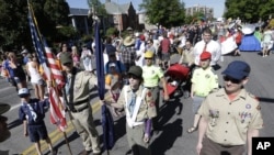 Boy Scouts line up before marching in the Utah Gay Pride Parade in Salt Lake City on Sunday, June 2, 2013.
