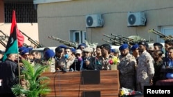 Al Qaqaa brigade commander Othman Mlekta gives announcing withdrawal from Tripoli during handing over ceremony of Zintan's al Qaqaa brigades' base, Mittiga airbase, Libya, Nov. 21, 2013.