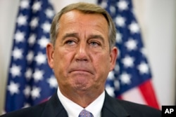 FILE - In this Sept. 9, 2015, file photo, Speaker of the House John Boehner pauses during a news conference with members of the House Republican leadership on Capitol Hill in Washington.