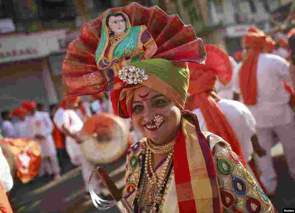 A Maharashtrian woman dressed in traditional costume attends celebrations to mark the Gudi Padwa festival in Mumbai, India.