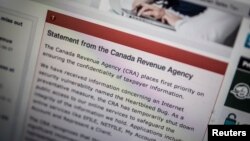 The Canada Revenue Agency website is seen on a computer screen displaying information about an Internet security vulnerability called the "Heartbleed Bug," in Toronto, April 9, 2014.