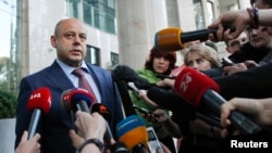 Ukrainian Energy Minister Yuri Prodan speaks with journalists as he arrives for talks with members of the Russian delegation and European Union Energy Commissioner Guenther Oettinger in Kyiv, June 14, 2014. 
