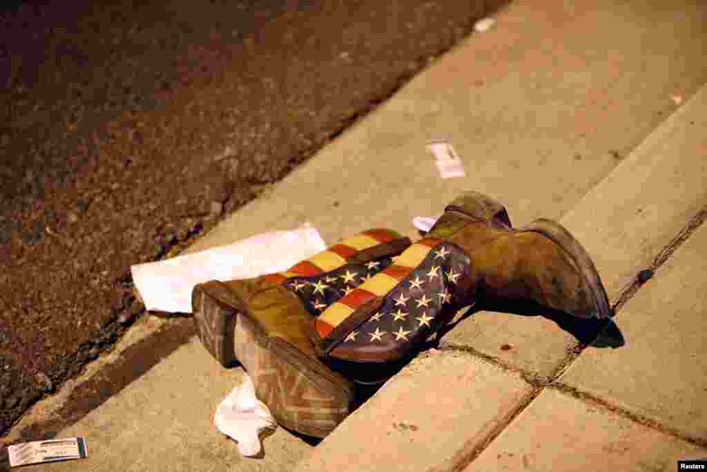 A pair of cowboy boots is shown in the street outside the concert venue after a mass shooting at a music festival on the Las Vegas Strip in Las Vegas, Nevada, U.S.