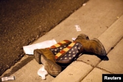 A pair of cowboy boots are seen left in the street outside the concert venue after the mass shooting at a music festival on the Las Vegas Strip in Las Vegas, Nevada, Oct. 1. 2017.