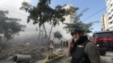 Civil defence members work at a damaged site, in the aftermath of Israeli strikes on Beirut's southern suburbs, Lebanon, Oct. 20, 2024. 