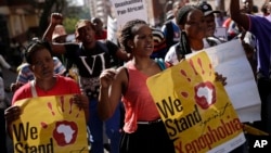 FILE - People rally during a march against xenophobia, in downtown Johannesburg, South Africa, 2015. Anti-foreigner sentiments have been on the rise in the country which, according to most recent data, is home to some two million foreign nationals.