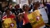 FILE - People rally during a march against xenophobia, in downtown Johannesburg, South Africa, 2015. Anti-foreigner sentiments have been on the rise in the country which, according to most recent data, is home to some two million foreign nationals.