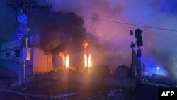 TOPSHOT - This handout photograph taken and released by the State Emergency Service of Ukraine on December 6, 2024, shows a building burning in the aftermarth of an airstrike in Zaporizhzhia, amid the Russian invasion in Ukraine. (Photo by Handout / STATE