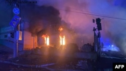 This photo released by the State Emergency Service of Ukraine on Dec. 6, 2024, shows a building burning in the aftermath of an airstrike in Zaporizhzhia. The Russian attack killed 10 people.