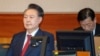 South Korea's impeached President Yoon Suk Yeol attends a hearing at his impeachment trial over his short-lived imposition of martial law, at the Constitutional Court in Seoul, Feb. 20, 2025. 