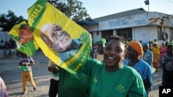 Supporter of the ruling CCM party in Tanzania celebrate after the party’s presidential candidate, John Pombe Magufuli was declared a winner, in Dar es Salaam, Tanzania, Oct. 29, 2015.