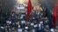Iranian pro-government supporters march during the funeral of a young member of the Revolutionary Guards, Sajjad Shahsanai, in the city of Najafabad, Jan. 3, 2018. At least three other towns near the cultural hub of Isfahan also saw violence overnight, causing the deaths of a young member of the Revolutionary Guards, a policeman and a bystander. 