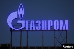 FILE - The logo of Gazprom company is seen on the facade of a business center in St. Petersburg, Russia, March 31, 2022.