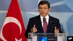 Turkish Prime Minister Ahmet Davutoglu speaks during a media conference at NATO headquarters in Brussels on Nov. 30, 2015.