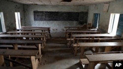 FILE - An empty classroom is seen following an attack by gunmen at a school in Kagara, Nigeria, Feb. 18, 2021. Gunmen have attacked a school in the country's north-central Niger state Sunday, according to local officials.