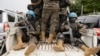 Members of the United Nations Organization Stabilization Mission in the Democratic Republic of the Congo ride on a pickup as they secure the evacuation of non-essential
UN staff in Goma, Congo, Jan. 25, 2025.
