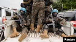 Members of the United Nations Organization Stabilization Mission in the Democratic Republic of the Congo ride on a pickup as they secure the evacuation of non-essential UN staff in Goma, Congo, Jan. 25, 2025.
