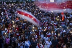 Opposition supporters rally to protest against disputed presidential election results on Independence Square in Minsk, Aug. 20, 2020.