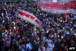Opposition supporters rally to protest against disputed presidential election results on Independence Square in Minsk, Aug. 20, 2020.