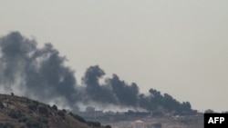 FILE - Smoke billows from the site of an Israeli strike on the southern Lebanese village of Taybeh on Aug. 4, 2024, amid ongoing cross-border clashes between Israeli troops and Lebanon's Hezbollah fighters.