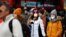 People are pictured wearing protective face masks in London, March 2, 2020.