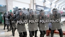 FILE - Riot police prepare to disperse protesters during a rally against Nicaraguan President Daniel Ortega's government, inside Metrocentro mall in Managua, Nicaragua, Feb. 25, 2020.