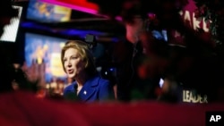 Republican presidential candidate, businesswoman Carly Fiorina speaks with the media during a campaign stop at the Peppermill Fireside Lounge, Jan. 18, 2016, in Las Vegas.