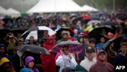 FILE - Attendees listen to speakers during the National Atheist Organization's "Reason Rally" March 24, 2012 on the National Mall in Washington, DC. 