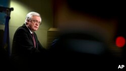 FILE - British Secretary of State for Exiting the European Union David Davis speaks during a media conference at EU headquarters in Brussels, March 19, 2018. 